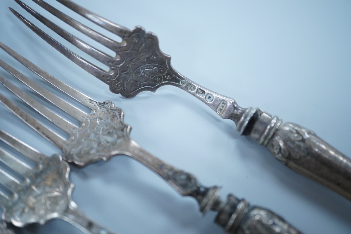 Eight Victorian silver fish forks and seven fish knives, by Hilliard & Thomason, Birmingham, 1878, with loaded unmarked white metal handles, one a plated replacement.